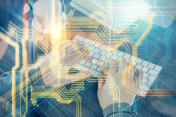 Double exposure of world map hologram with man working on computer on background. Concept of worldwideweb.