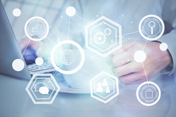 Social network theme hologram with businessman working on computer on background. Multi exposure.