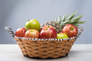 fruits in an arrangement on a white wooden surface with a white background. selective focus.