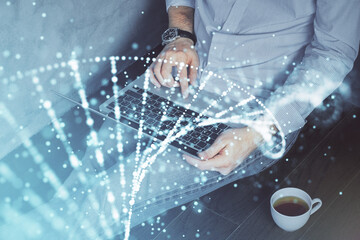 DNA hologram with businessman working on computer on background. Concept of bioengineering. Double...