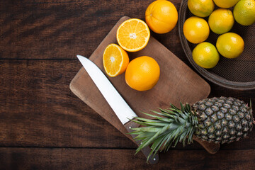 fruits arranged on a rustic wooden surface with a black background. selective focus.