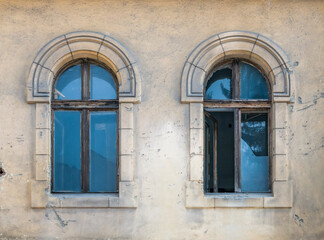 Close up detail with a worn out old medieval building in the center of Brasov, Romania.