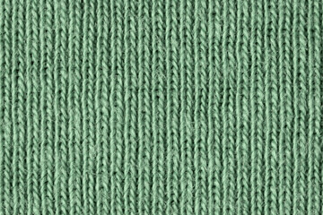 Faded green cotton fibres close up
