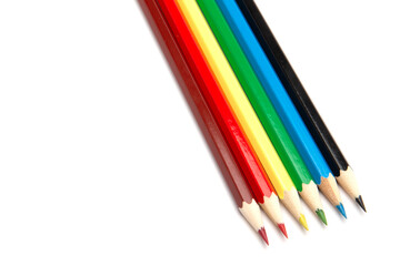 A lot of colorful wooden pencils on a white background