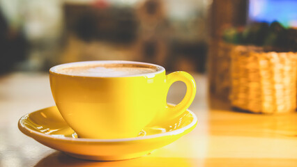 A cup of coffee with milk in a coffee shop