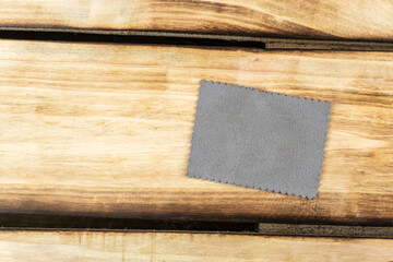 Gray patch on a wooden background.