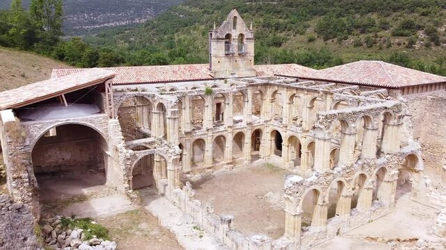 Aerial view of the Ruins Of An Ancient Abandoned Monastery In Santa Maria De Rioseco, Burgos, Spain. High quality 4k footage.