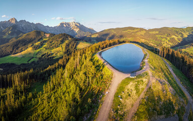 Aerial view over mountain landscape with reservoir lake, Salzburg, Austria