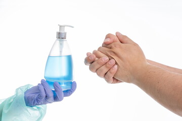 Doctor offering hand sanitizer to patient on white background