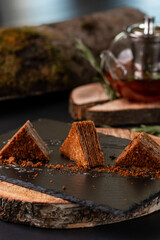 traditional honey cake on a plate close-up on a background. tasty chocolate dessert