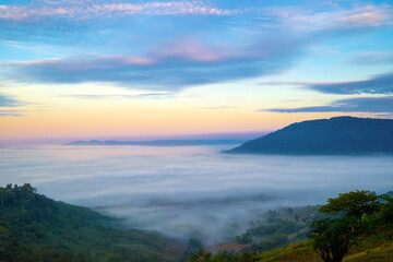 Fototapeta premium Beautiful landscape of mountain misty morning sunrise is the travel destination and famous place at Khao Kho district, Phetchabun province, Thailand. Relaxation with the natural