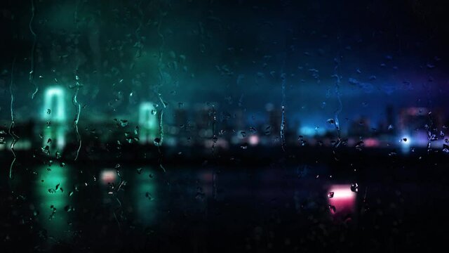Beautiful cinematic rainy city window backdrop A rain covered window with blurry city lights bokeh background and raindrops running down the glass