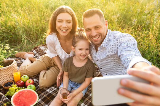 Happy Family Taking Selfie In The Countryside