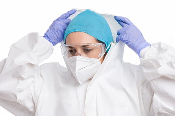 Female doctor putting on an PPE, white background
