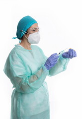 Fototapeta na wymiar Female doctor with gloves and mask preparing vaccine on white background