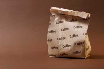 paper bag with coffe , paper bag for coffee, delivery, purchase, packaging, brown background