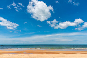 Fototapeta na wymiar Sea view from tropical beach with sunny sky for background.