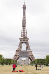 Paris, France, June 06, 2020: the Eiffel Tower in Paris and tourists