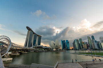 Beautiful architecture building skyscraper around marina bay and sky background in singapore city. decoration image contain certain grain noise and soft focus