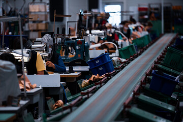 Shoe making process in footwear factory.