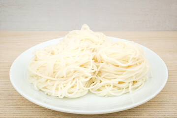 Flour noodles on white background
