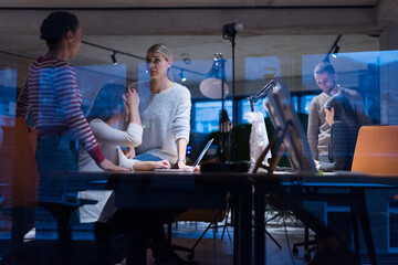 Meeting of co-workers and planning next steps of work. Young business group in discussion in their office. Startup people working in office.