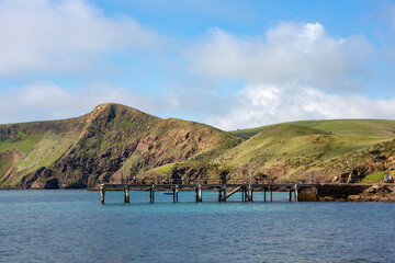 The iconic jetty with rolling green hills in the background  on the fleurieu peninsula at second valley south australia on july 14 2020