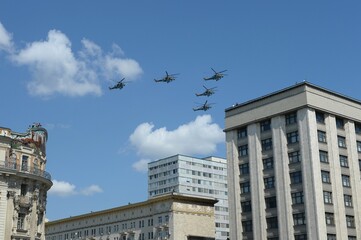 Fototapeta na wymiar Mi-35M attack helicopters in the sky over Moscow during the parade dedicated to the 75th anniversary of Victory in the Great Patriotic War