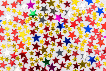 festive background with a pattern of multicolored stars