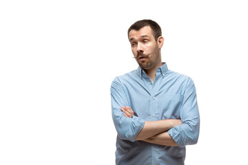 Bored, sceptical. Young man with funny, unusual popular emotions and gestures isolated on white...
