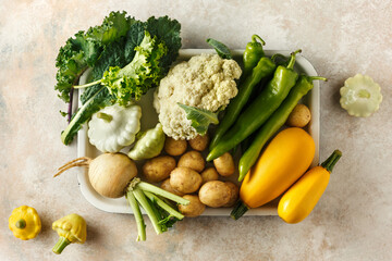 Various types of seasonal vegetables on a tray. Top View.