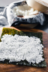 plant-based food, vegan sushi with seaweed and sticky rice getting prepared