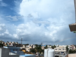 Rainbow and blue clouds and sky in the city