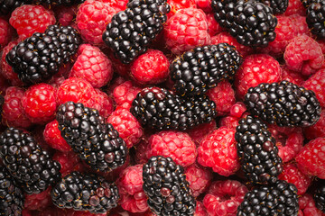 Tasty raspberry and blackberry background.