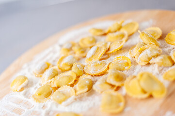 Italian pasta preparation, agnolotti with flour and eggs stuffed with meat, typical Italian food