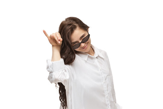 Salt bae. Young caucasian woman with funny, unusual popular emotions and gestures on white studio background. Human emotions, facial expression, sales, ad concept. Trendy look inspired by memes.