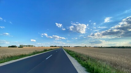 Road in Poland. Polish village, cottage. Sunny day Lubusz district. Clouds, route © Mateusz