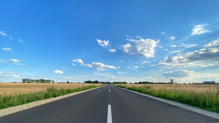Road in Poland. Polish village, cottage. Sunny day Lubusz district. Clouds, route © Mateusz