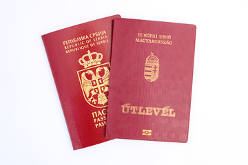 Dual citizenship, Serbian and Hungarian passports on white background