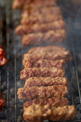 Minced pork rolls on barbecue