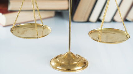 law concept with books and scales of justice.