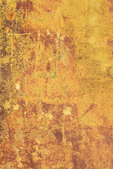 Old rusty metal surface with yellow and brown paint flaking and cracking texture, may used as background.
