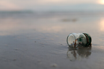 Waste glass bottles, pollution, leave on the beach Environmental protection (Environmental concept Natural treatment)