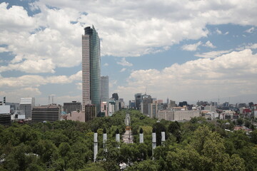 Fototapeta premium View of Mexico city skyline along Paseo de la Reforma avenue as seen from Chapultepec Castle in Mexico city, Mexico.