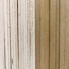 Several sheets of new clean plywood in a stack. Sale of goods for repair and decoration. Wood and texture. Abstract background and shallow depth of field.