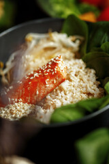 Various culinary dishes on a dark wooden table. Exquisite restaurant serve on dark dishes
