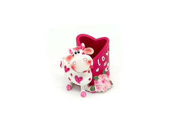 Ceramic toy cow isolated on a white background