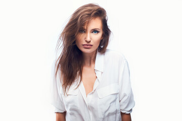 close-up portrait of a beautiful woman on a white background in a light shirt