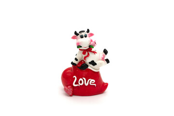 Ceramic toy cow isolated on a white background