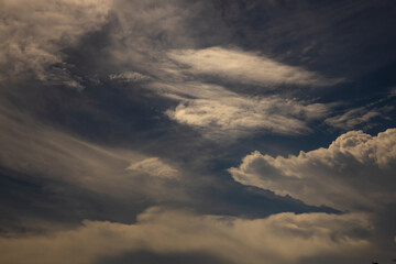 sunshine and white fluffy clouds in the blue sky .blue sky background with tiny clouds